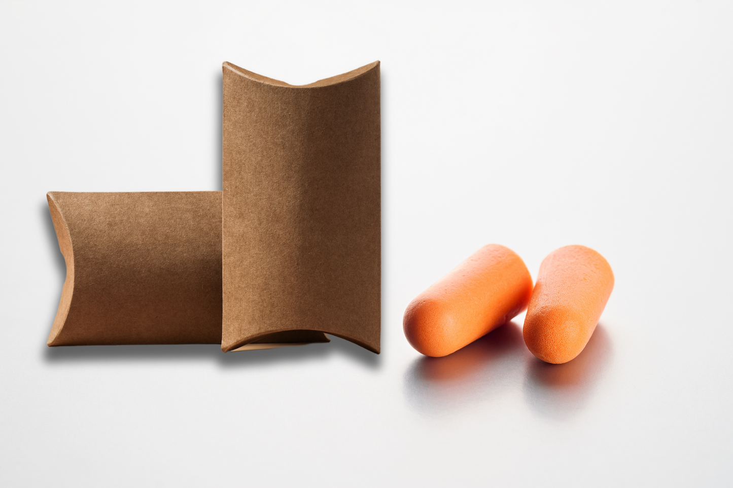 A photo of Earplugs in pillow-box with logo from JM Band®. Purchase Earplugs in Orange here.